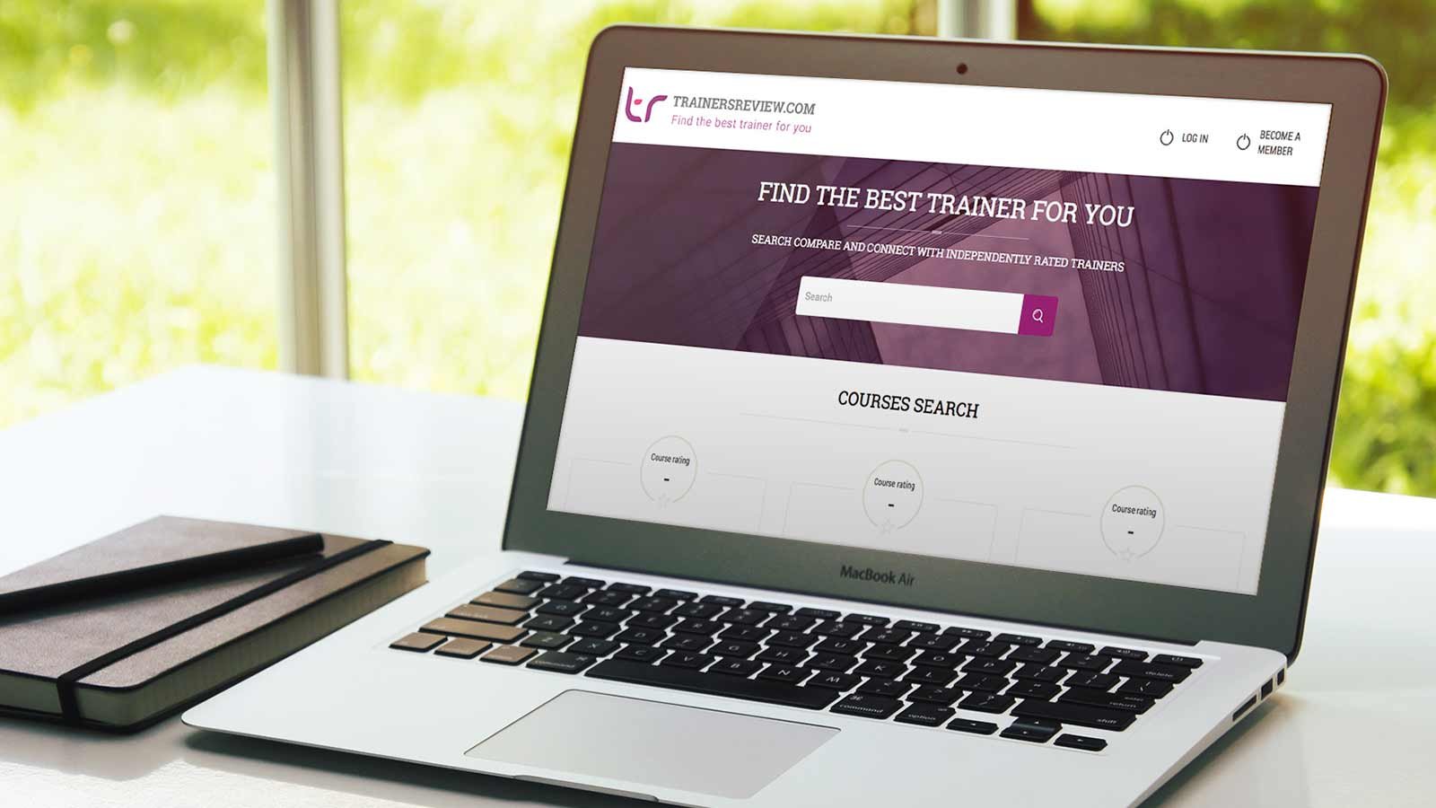 Screenshot of the Trainersreview.com homepage on a laptop