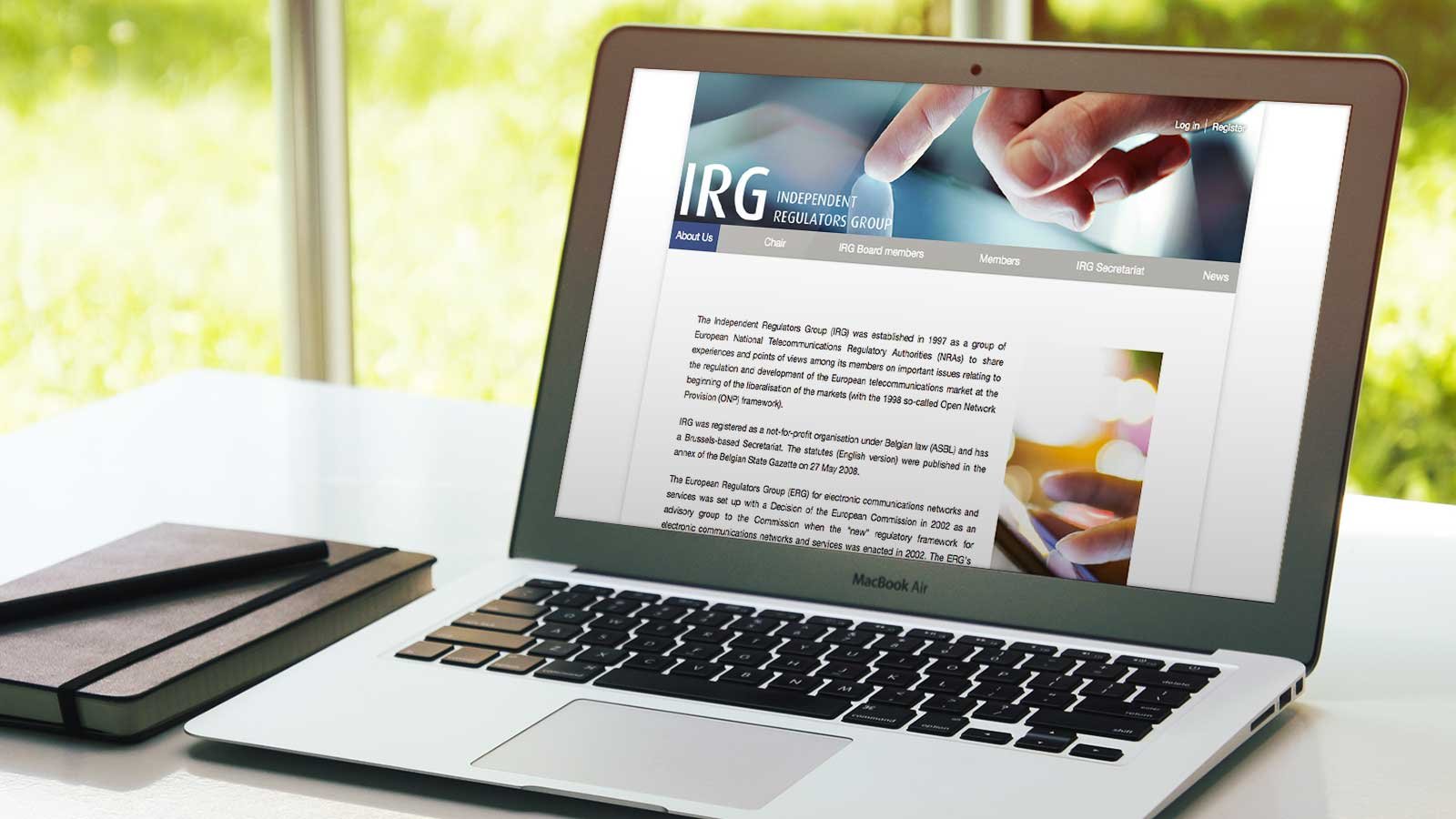 Screenshot of the IRG homepage on a laptop