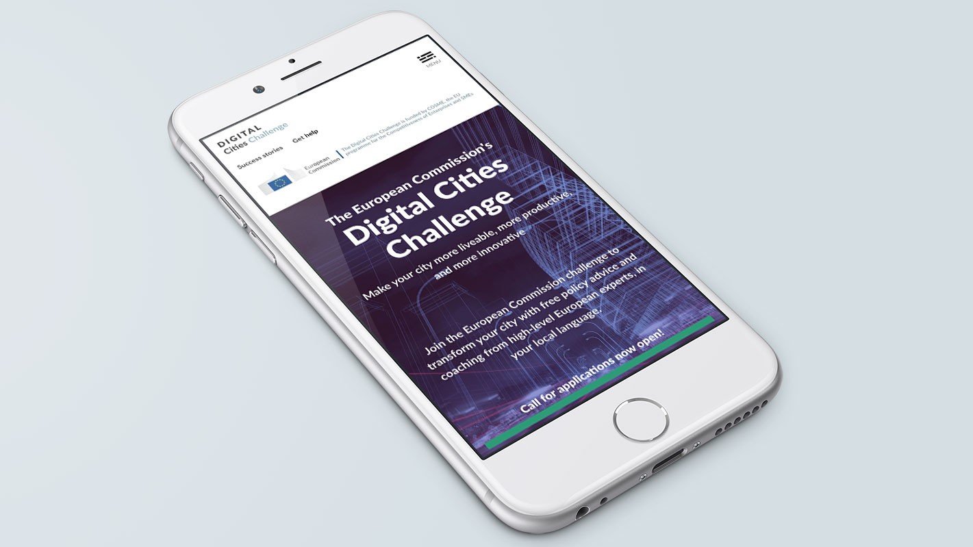 Screenshot of the Digital Cities Challenge homepage on a laptop