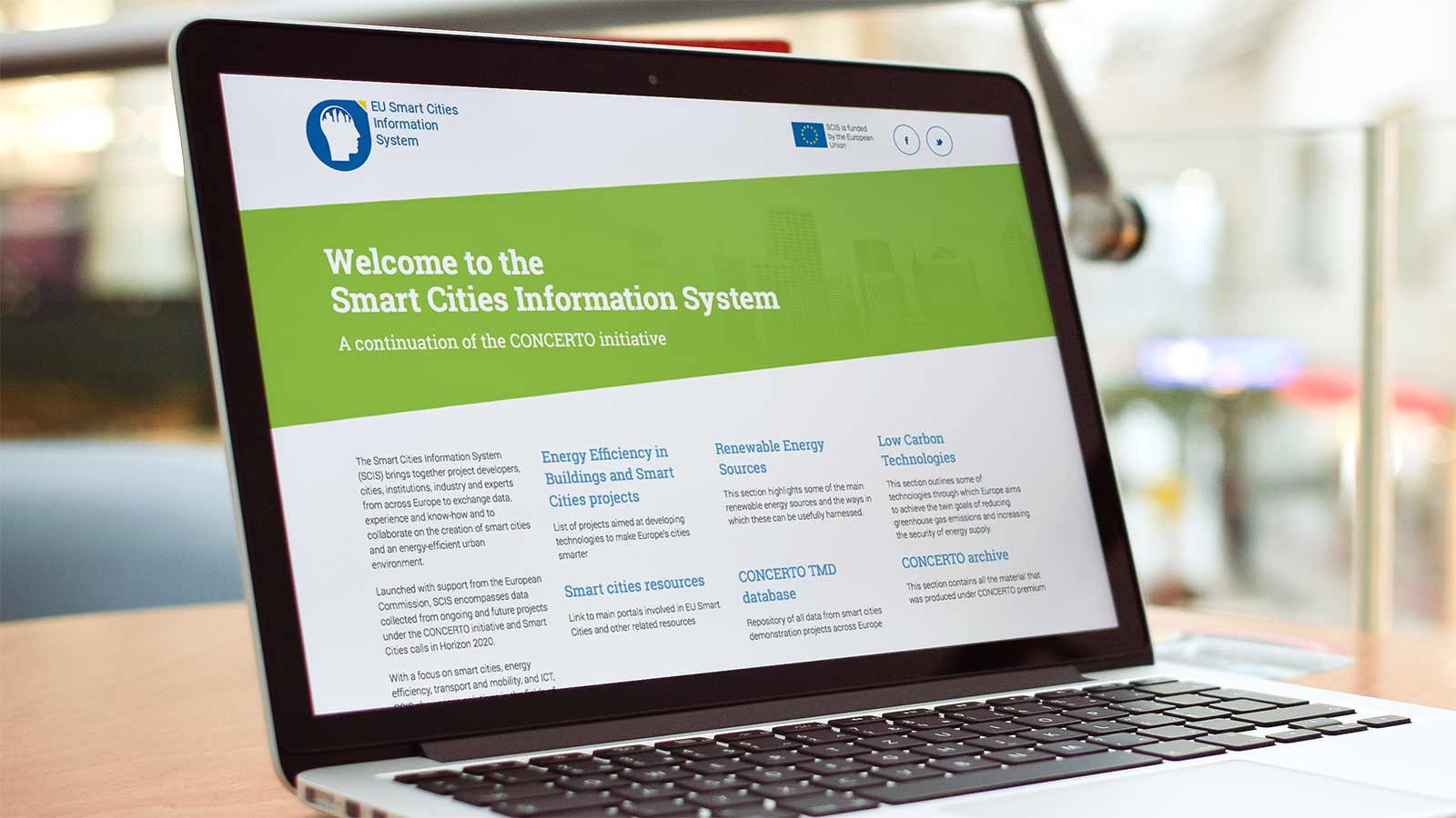 Screenshot of the SCIS homepage on a laptop